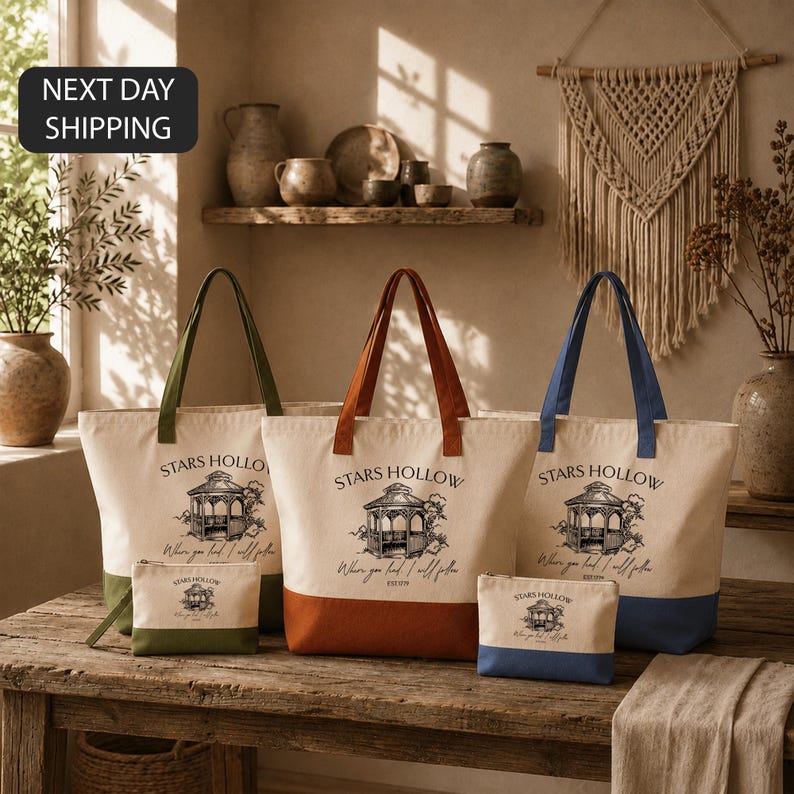 a collection of tote bags and a small bag, all featuring the same design and text, arranged on a wooden surface.