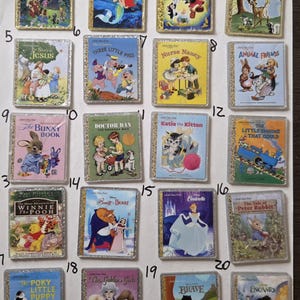 May include: A collection of twenty rectangular magnets featuring classic children's book covers, including Peter Pan, The Little Mermaid, Pinocchio, Bambi, The Story of Jesus, Three Little Pigs, Nurse Nancy, Animal Friends, The Bunny Book, Doctor Dan, Katie the Kitten, The Little Engine That Could, Winnie the Pooh, Beauty and the Beast, Cinderella, The Tale of Peter Rabbit, The Poky Little Puppy, The Golden Girls, Brave, and Encanto.