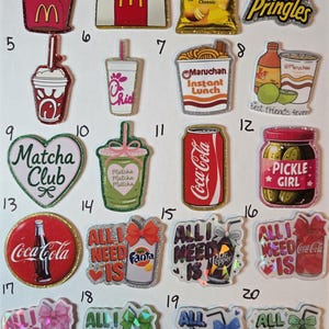 May include: A collection of glittery food and beverage-themed stickers. Includes McDonald's fries, Lay's chips, Pringles, Coca-Cola, Fanta, Dr. Pepper, Sprite, Pepsi, and Mountain Dew. Also features a pickle jar and instant ramen.