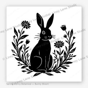 Puede incluir: Silueta negra de un conejo rodeado de elementos florales sobre fondo blanco. El diseño incluye margaritas, tulipanes y ramas frondosas. El conejo tiene orejas largas y bigotes. El texto en la parte inferior dice "Spring Bunny Botanical - Bunny Bloom."
