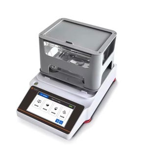 May include: A laboratory scale with a gray and clear chamber on top of a white base. The scale has a digital display with icons and text. The base has red feet. The scale is designed for precise measurements.