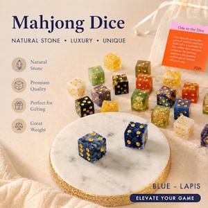 May include: A collection of colorful Mahjong dice made of natural stone. The dice are in various colors, including blue, yellow, green, and black, with gold-colored pips. The text "Mahjong Dice" is at the top.