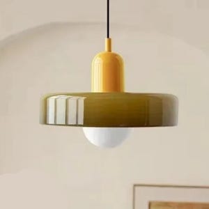 May include: A rustic wooden sign with the text "Welcome to our home" in white lettering. The sign features a distressed finish and a simple, inviting design, perfect for front door decor.