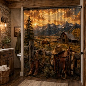 May include: A western-themed shower curtain with a scenic landscape of mountains, a barn, and horses grazing. The image includes a cowboy hat, saddle, boots, and rope, creating a rustic aesthetic. The color palette features warm tones of brown, orange, and yellow.