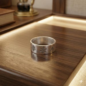 May include: A handmade, wooden cutting board with a natural finish. The board features a live edge on one side and a rectangular shape. It is approximately 18 inches long and 12 inches wide.