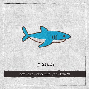 May include: A cartoon-style embroidered shark in shades of blue, brown, and white. The shark has a friendly appearance and is set against a textured gray background. The text "5 SIZES" is below the shark, with file type extensions below that.