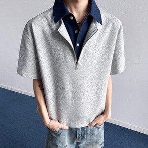 Half Zip Polo Shirt | Short Sleeve Casual Top | Daily Wear | Minimal Streetwear Style

Half zip polo shirt with layered collar and relaxed minimalist streetwear style