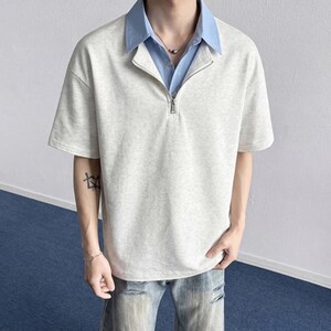 Half Zip Polo Shirt | Short Sleeve Casual Top | Daily Wear | Minimal Streetwear Style

Half zip polo shirt with layered collar and relaxed minimalist streetwear style