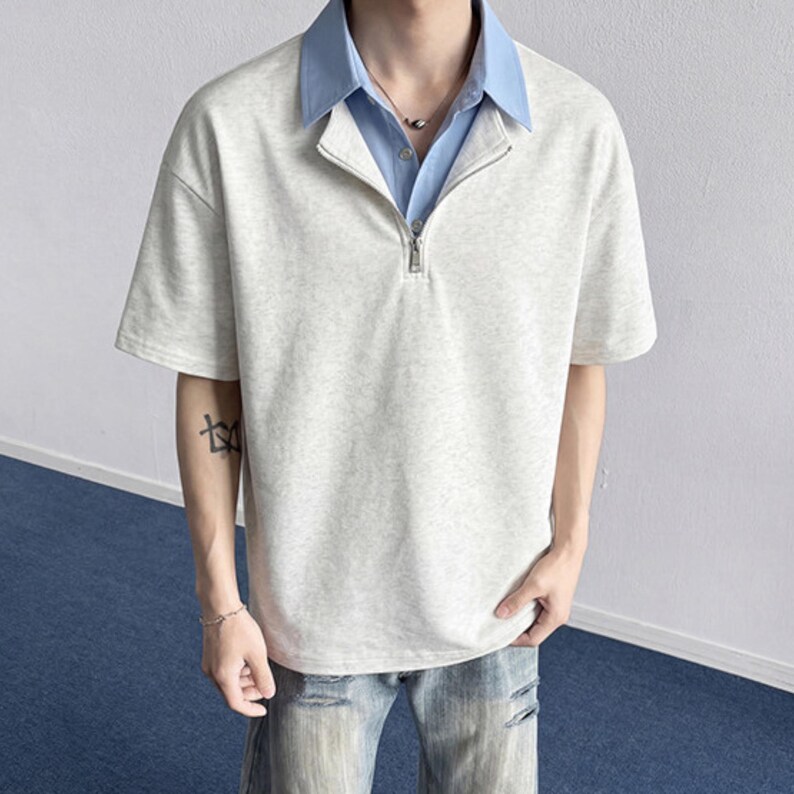 Half Zip Polo Shirt | Short Sleeve Casual Top | Daily Wear | Minimal Streetwear Style

Half zip polo shirt with layered collar and relaxed minimalist streetwear style