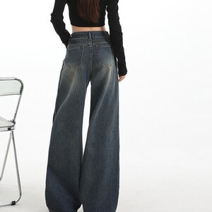 Women's Wide Leg Jeans | High Waisted Denim Pants | Korean Streetwear Style | Retro Y2K Trend

High waisted wide leg jeans with washed denim finish for korean streetwear styling