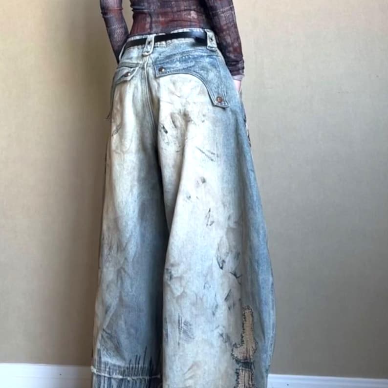 Washed Baggy Denim Jeans | Wide Leg Graphic Pants | Retro Y2K Streetwear 

Washed baggy wide leg denim jeans with graphic print and distressed detailing designed for women streetwear styling and relaxed outfits.