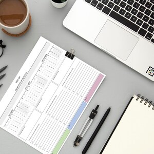 Office productivity planning sheet for 2026 featuring horizontal quarterly overview with side-by-side monthly sections and objective tracker space.