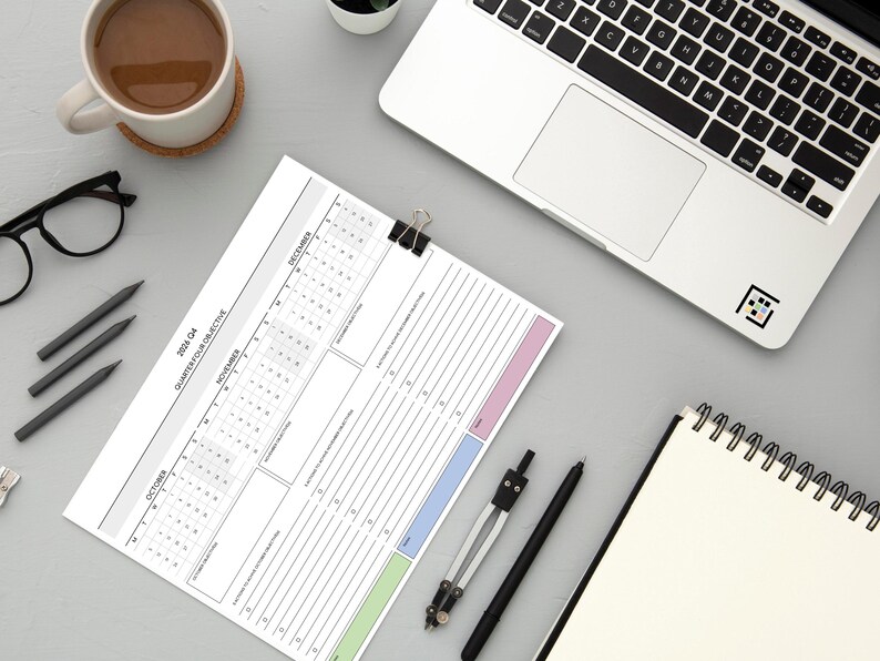 Office productivity planning sheet for 2026 featuring horizontal quarterly overview with side-by-side monthly sections and objective tracker space.