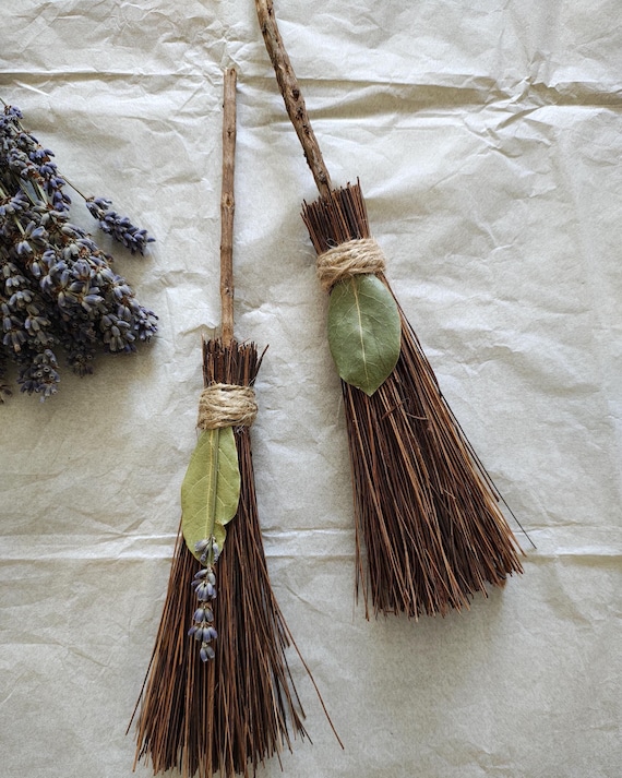A hand-bound 10" mini besom broom made in Scotland — a real ritual/altar tool with genuine cottagecore and folk-craft credibility you can't get at a big-box store.