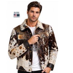 May include: A brown and white cowhide jacket with a shearling collar. The jacket has a button-up front, two chest pockets, and leather accents on the cuffs. The jacket is a medium weight and is suitable for cooler weather.