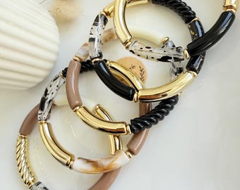 Pulseira rígida boho personalizada feita com contas tubulares curvas, uma tendência de 2026. O presente perfeito para o Dia das Mães.