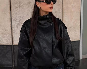 Oversized retro echt zwart leren jack uit de jaren 90: vintage bomberjas met boxy pasvorm