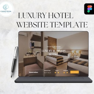 May include: A laptop screen showing a "Luxury Hotel Website Template" with a hotel room interior and booking options. A silver and black pen lies beside the laptop. The text reads "Luxury Business Hotel".