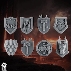 May include: A collection of eight gray miniature shields with various designs. The shields feature flames, a hammer, a dragon head, and other fantasy-themed elements. Ideal for tabletop gaming or crafting.