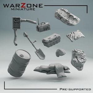 May include: A selection of grey miniature war zone accessories, including a radio, shovel, barrel, sandbags, and a toolbox. The image also features two rock formations and a helmet. The text "WARZONE MINIATURE" and "PRE-SUPPORTED" are visible.