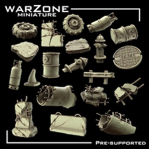 May include: A collection of miniature terrain pieces for tabletop gaming, including tires, concrete barriers, rocks, and a fire hydrant. The pieces are in a muted color palette, with the text "WARZONE MINIATURE" and "PRE-SUPPORTED".