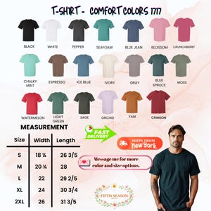 Op de afbeelding: Een display van Comfort Colors 1717 t-shirts in diverse kleuren, waaronder zwart, wit en blue jean. De afbeelding toont een maattabel met afmetingen in cm en een man die een donkergroen t-shirt draagt.