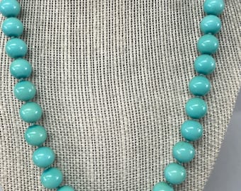 Kissaka hand knotted turquoise blue faux pearl fashion necklace with earrings.