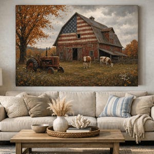 May include: A wall art print depicting a rustic red barn painted with an American flag design. A vintage red tractor sits in the foreground near a large autumn tree. Two cows graze in the field in front of the barn under a cloudy sky.