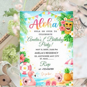 May include: A white ceramic mug with a black handle and the text "But First, Coffee" in a black, bold font. The mug is sitting on a white surface. The mug is approximately 4 inches tall.