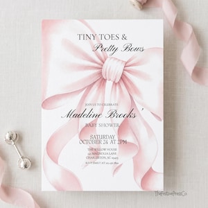 May include: A rectangular baby shower invitation card featuring a large, soft pink watercolor bow illustration. The text reads: TINY TOES & Pretty Bows, JOIN US TO CELEBRATE Madeline Brooks', BABY SHOWER, SATURDAY OCTOBER 24 AT 2PM, THE WILLOW HOUSE, 145 MAGNOLIA LANE, CHARLESTON, SC 29403, RSVP: EMILY AT 123 456 7890.