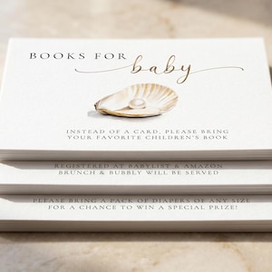 May include: A stack of white baby shower invitation cards. The cards feature the text "BOOKS FOR baby" with an illustration of a seashell and pearl. Additional text includes requests for children's books and diapers. The cards are for a baby shower.