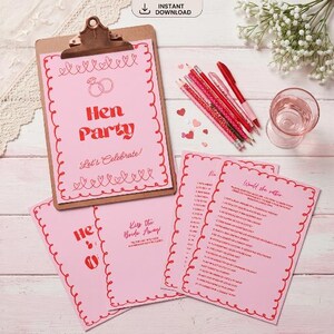May include: A pink hen party game set with a clipboard, pencils, and cards. The clipboard features the text "Hen Party" and "Let's Celebrate!". The cards include phrases like "Kiss the Bride Away" and "Would she rather".