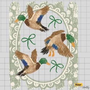 May include: A graphic design featuring three mallard ducks in flight with brown, green, and blue plumage. The ducks are arranged around three green hand-drawn bows against a light gray background with a decorative sage green oval border. Text reads Wear Your Identity.