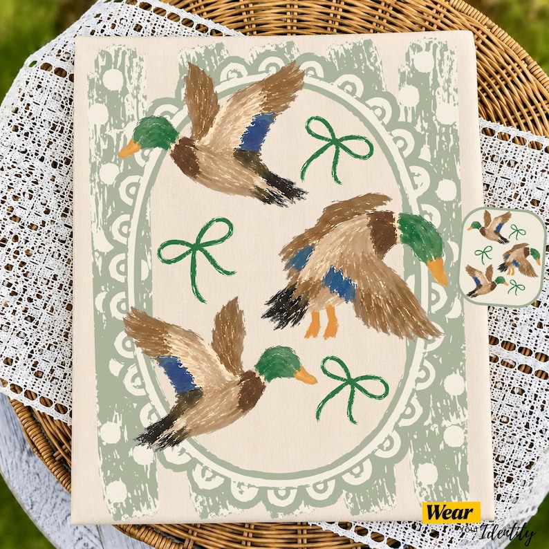 May include: A rectangular canvas print featuring three mallard ducks in flight, painted in brown, green, and blue. The ducks are arranged within a sage green scalloped oval frame decorated with white polka dots and small green ribbon bows.