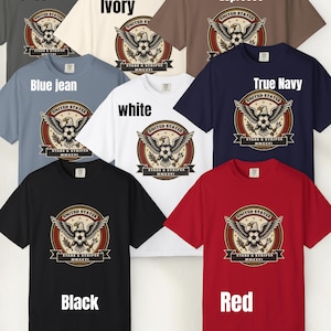 May include: A collection of eight t-shirts in various colors, including pepper, ivory, espresso, blue jean, white, true navy, black, and red. Each shirt features a graphic with an eagle, soccer ball, and text that reads "UNITED STATES STARS & STRIPES MMXXVI".