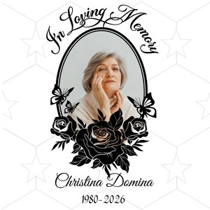 May include: A memorial portrait featuring a woman in a black oval frame, with the words "In Loving Memory" above. Black roses and butterflies surround the portrait, with the name "Christina Domina" and the years "1980-2026" below.