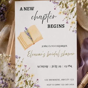 May include: A rectangular bridal shower invitation card featuring watercolor illustrations of wildflowers and an open book with a lavender sprig. The text reads: A NEW chapter BEGINS, JOIN US TO CELEBRATE Eleanor's bridal shower, SUNDAY | JULY 25 | 13 PM, 123 ANYWHERE, ANYCITY 123, RSVP TO EMMY 123-345-3434.