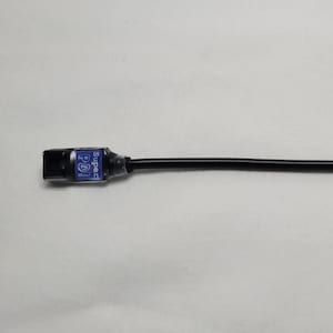 May include: A black USB Type-C to USB Type-C cable with a DC power connector. The cable has a blue label and is shown with the text "USB Type-C to USB Type-C".