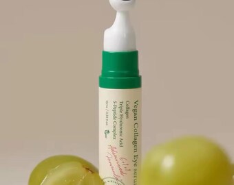 May include: A green and white Vegan Collagen Eye serum bottle with a metal rollerball applicator. The bottle contains 10ml / 0.33 fl oz of serum and features text that reads "Collagen Triple Hyaluronic Acid 5-Peptide Complex".