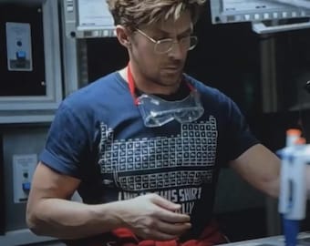 Camiseta "Usa esta camiseta periódicamente", Camiseta del Dr. Grace, Camiseta del Proyecto Ave María, ¡Ah! el elemento sorpresa, Camiseta con chiste de química, Camiseta de química
