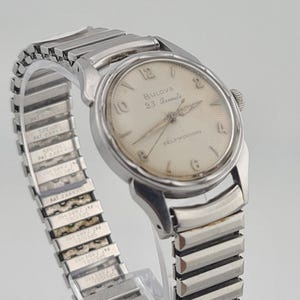 BULOVA 23 Sunburst automatisk klocka. 23 juveler 10BPAC automatisk 1950-tal. Fungerar.