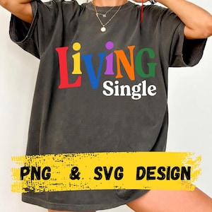 May include: Dark gray t-shirt with the words "Living Single" in colorful letters. The shirt also has the text "PNG & SVG DESIGN" in a yellow banner across the bottom.
