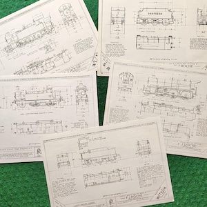 May include: Several vintage train blueprints are displayed on a green surface. The blueprints, in black and white, showcase detailed technical drawings of locomotives, including side and top views. Text includes "SOUTHERN", "GWR", and "FJ.ROCHE".