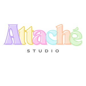 May include: The logo for Attach&eacute; Studio features the word Attach&eacute; in large, pastel-coloured letters with a light outline. The A is purple, t is yellow, t is pink, a is light blue, c is orange, and h is green. The word STUDIO appears below in black.