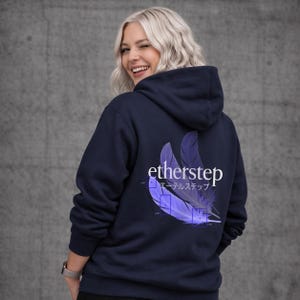 May include: Navy blue hooded sweatshirt with the word "etherstep" in white and Japanese text, along with a purple feather design on the back. The sweatshirt has a drawstring hood and a front pocket.