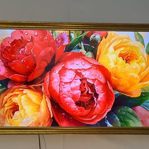 May include: A framed floral print featuring vibrant red and yellow peonies with water droplets. The artwork is encased in a gold-colored rectangular frame, creating a striking contrast. The image showcases a close-up view of the flowers, highlighting their intricate details and textures.