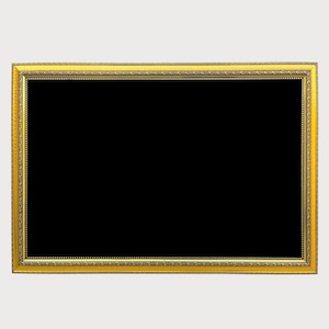 May include: A rectangular picture frame with a gold-coloured ornate border and a black interior. The frame has a detailed design along the edges, and the background is a solid white colour.
