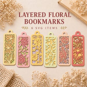 Peut inclure: Six marque-pages floraux superposés aux couleurs variées, dont le jaune, le rose et le vert. Chaque marque-page présente un motif floral unique. Le texte "LAYERED FLORAL BOOKMARKS" et "6 SVG ITEMS" est visible.