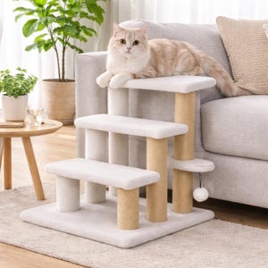 May include: A beige cat rests on a multi-level cat tree. The cat tree has three platforms covered in soft, light-colored fabric. The support posts are wrapped in natural-colored sisal rope. A small, dangling toy hangs from one platform.