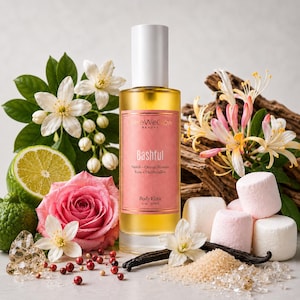 Luxury perfume body oil inspired by soft floral gourmand fragrances with orange blossom, rose, marshmallow, and vanilla notes, hydrating glow body oil for radiant skin, lightweight non greasy body elixir by HereWeGlow Beauty.